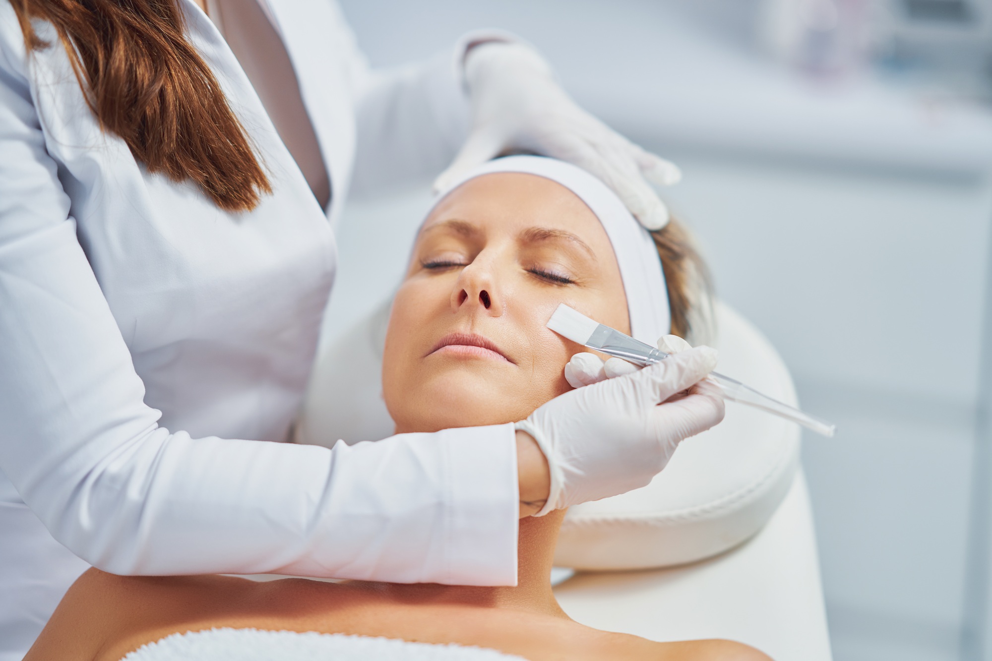 Woman in a beauty salon having face and body treatment
